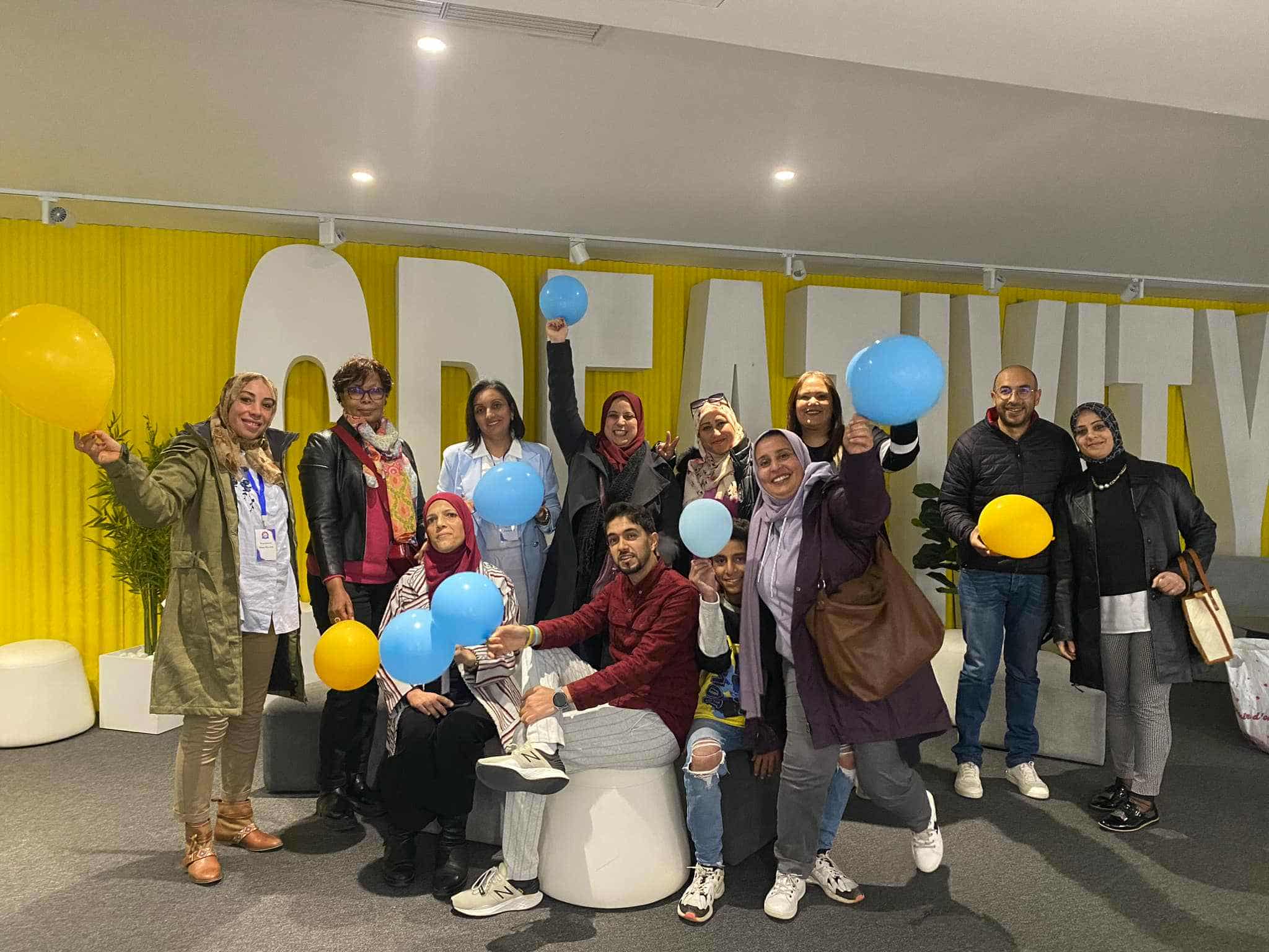 6. صورة جماعية للمشاركين – روح الفريق والتوازن